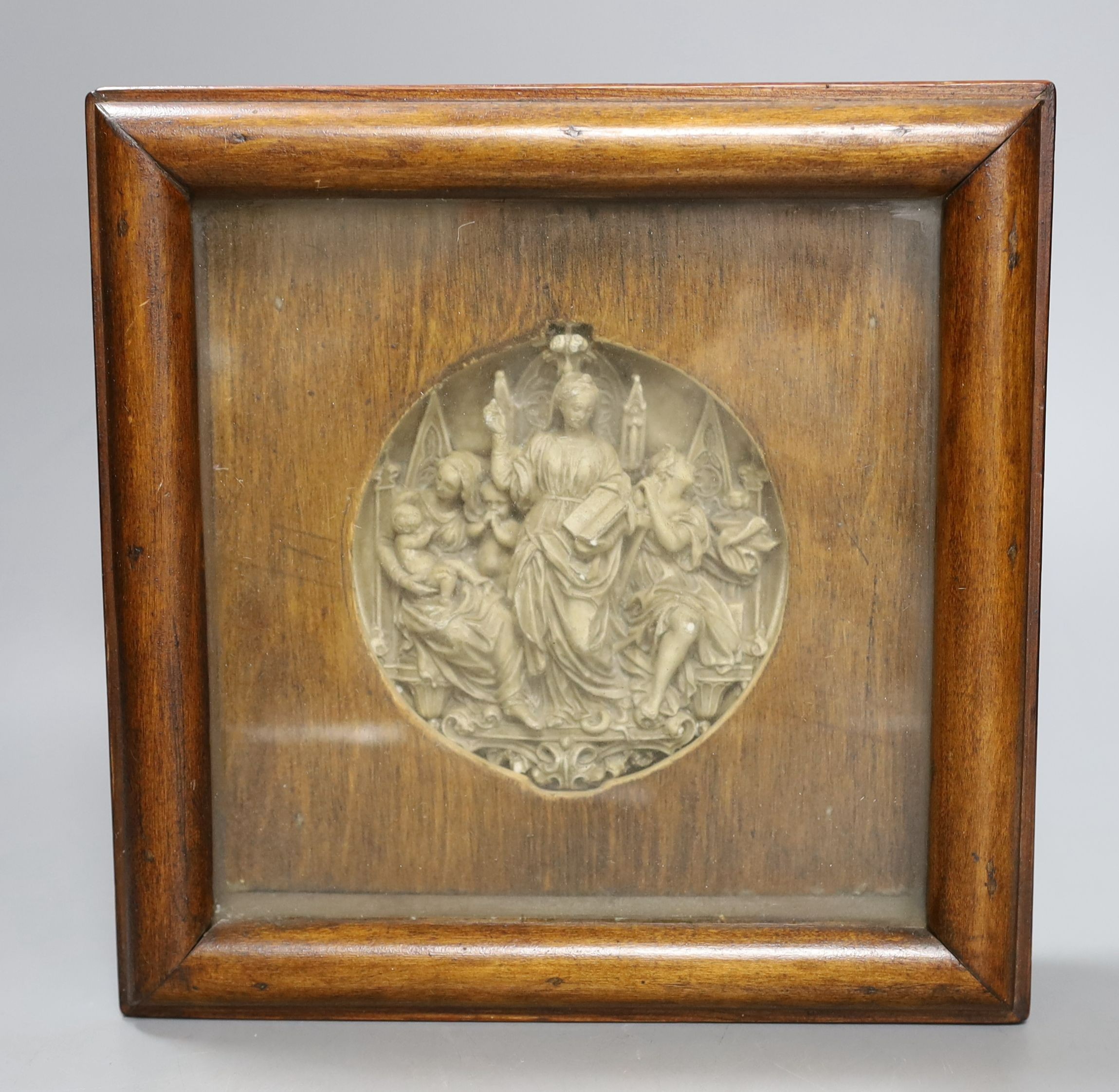 A 19th century Gothic revival plaster relief, depicting figures within altar frame, framed